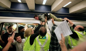 Protestor hops on top of BART train