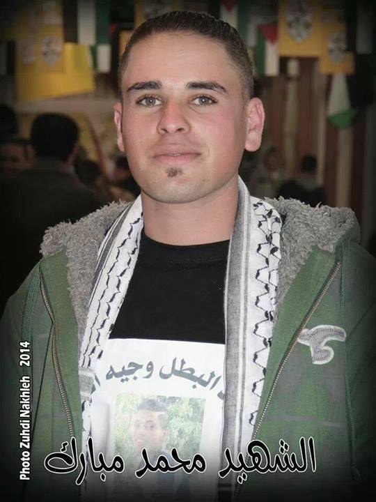 <b>Muhammad Mubarak</b> displaying another slain Palestinian on his t-shirt - palestinemartyriv